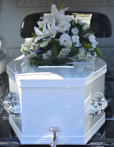 Beautiful White Coffin With Flowers